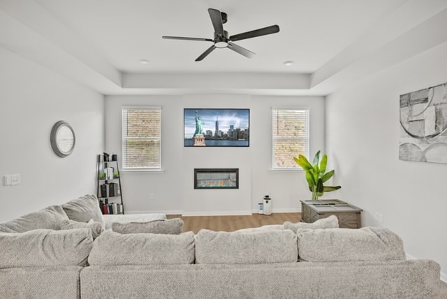 TV mounted above linear fireplace in a modern family room with ceiling fan — Radiant TV Installations, Gwinnett County, GA