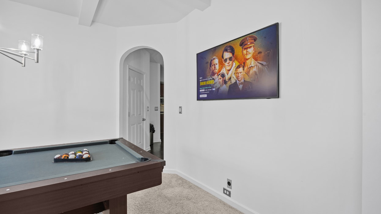 TV mounting above pool table in game room — professional installation by Radiant TV Installations